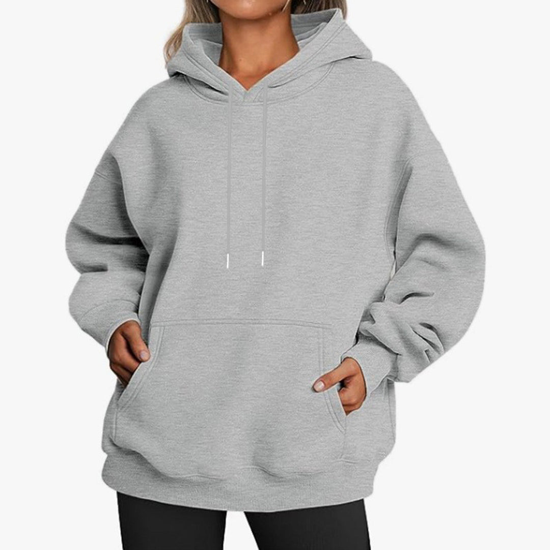 "Unisex Hoodie in Grau, weiche Baumwolle-Polyester-Mischung, modernes Design, vielseitig und bequem, ideal für jeden Anlass."