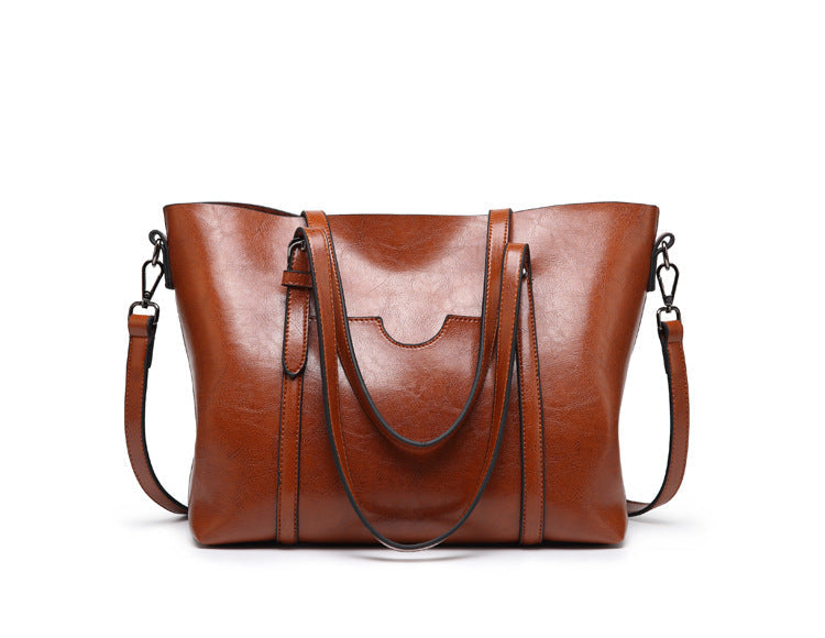 "Vegan lederhandtasche, stilvoll und geräumig mit handgefertigten Details, robuste Griffe, elegantes Design, Damenmode."