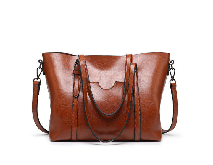 "Vegan lederhandtasche, stilvoll und geräumig mit handgefertigten Details, robuste Griffe, elegantes Design, Damenmode."