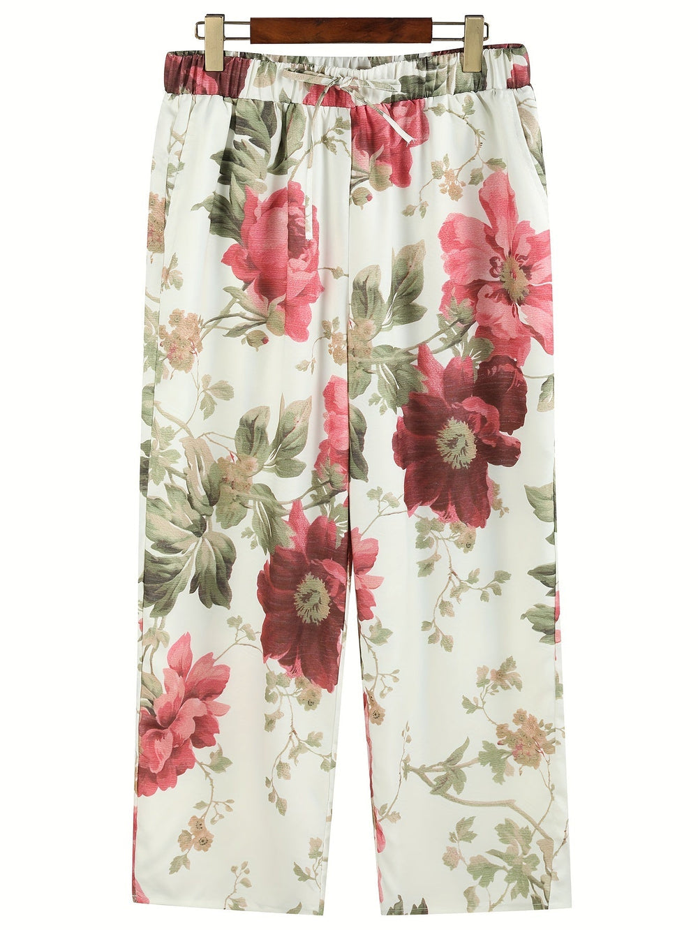 "Verkürzte Damenhose mit leuchtendem Blumenmuster, ideale Sommerhose, stilvoll und bequem, figurbetont und modern."