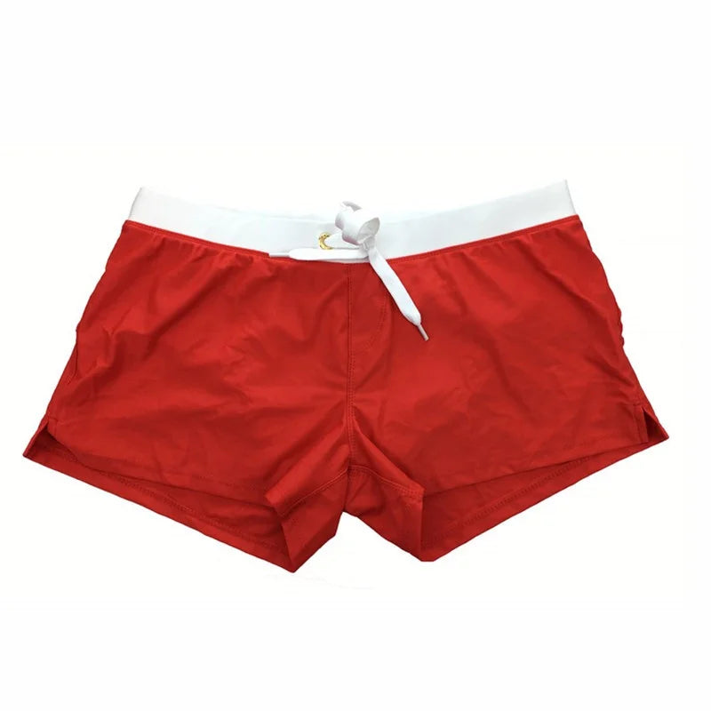 "Vielseitige Herren Badehose, schnell trocknend, komfortabel, blaues Design, ideal für Strand und Wasserabenteuer."