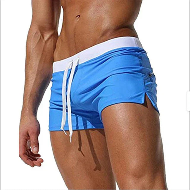 "Vielseitige Herren Badehose, schnell trocknend, komfortabel, blaues Design, ideal für Strand und Wasserabenteuer."