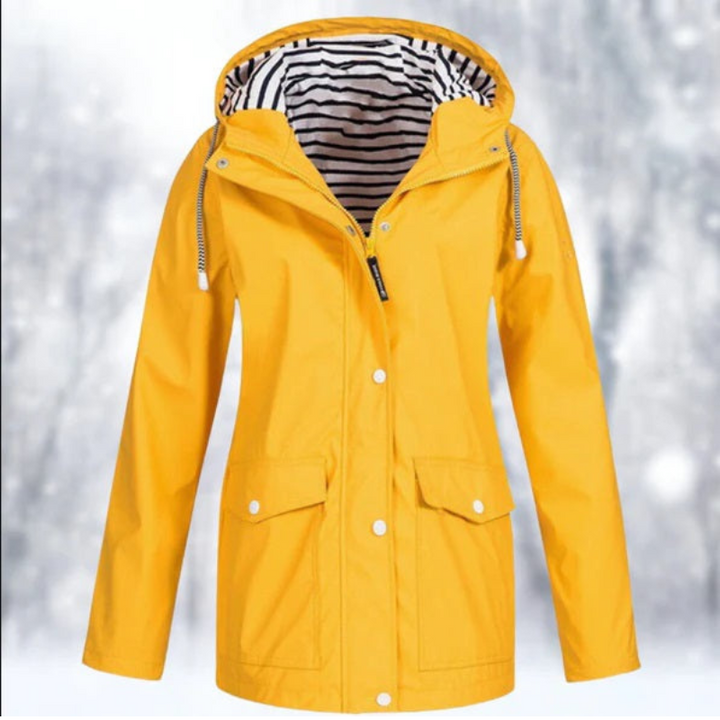 "Wasserdichte Damen Kapuzenjacke, stilvolles Design in Blau, perfekt für kalte, nasse Tage, mit ergonomischer Passform."