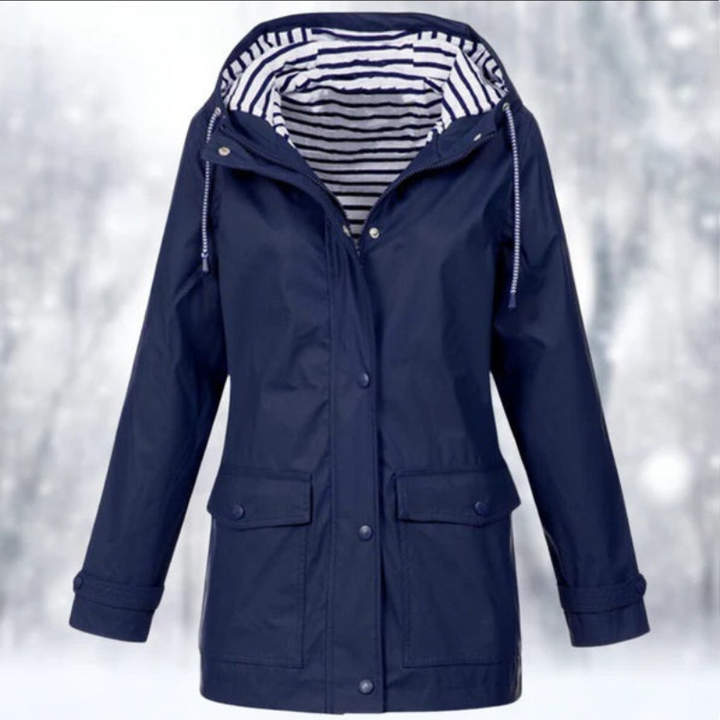 "Wasserdichte Damen Kapuzenjacke, stilvolles Design in Blau, perfekt für kalte, nasse Tage, mit ergonomischer Passform."
