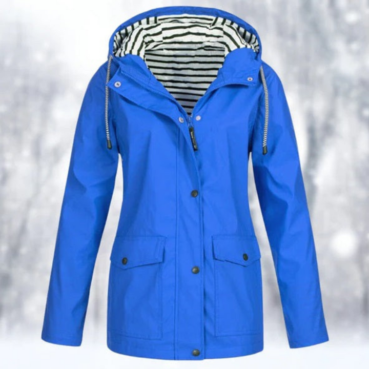 "Wasserdichte Damen Kapuzenjacke, stilvolles Design in Blau, perfekt für kalte, nasse Tage, mit ergonomischer Passform."