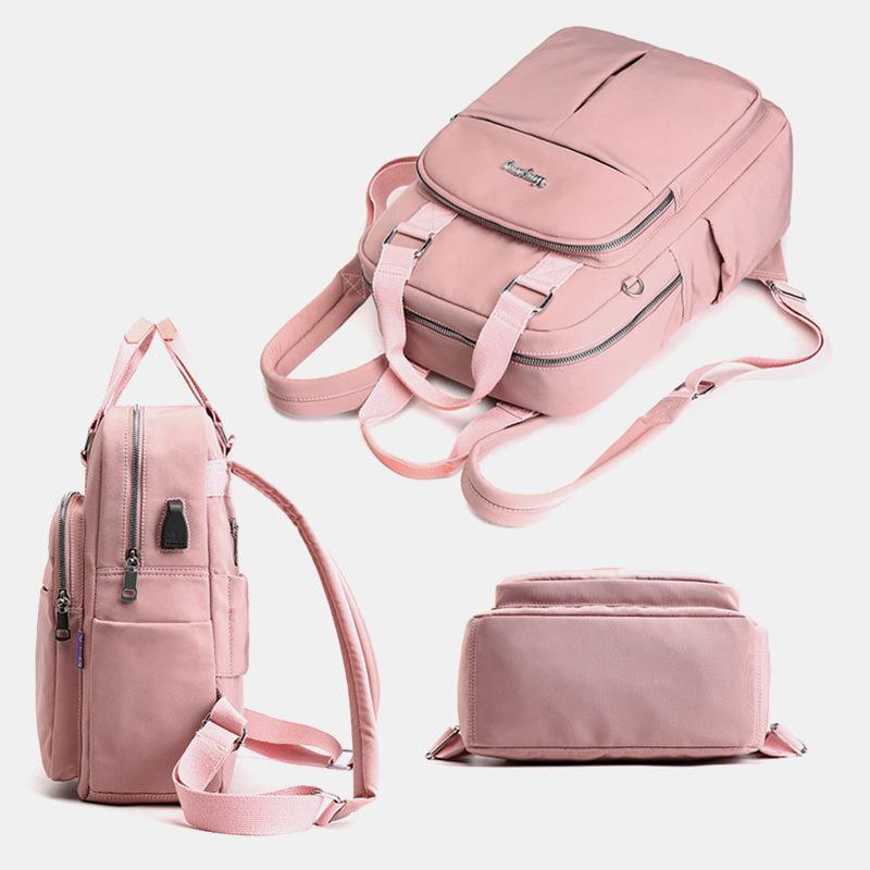 "Wasserfester Rucksack mit USB-Ladung, große Kapazität, schwarz, Vorderansicht; ideal für Reisen und Alltag."