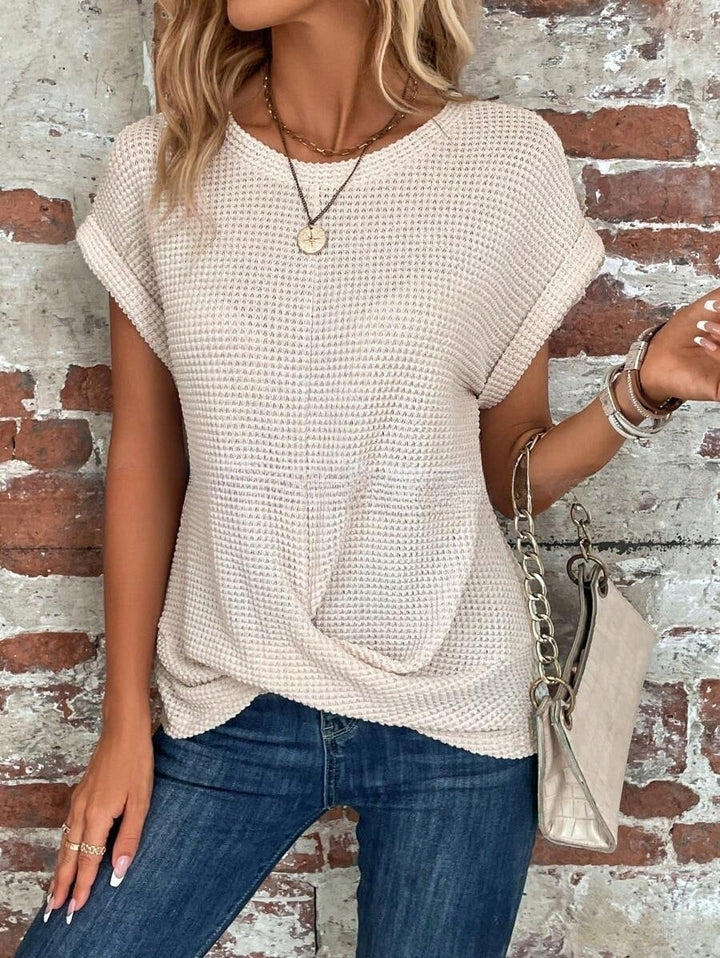 Weißes Damen-Kurzarm-T-Shirt, elegantes Design, vielseitig und komfortabel für jeden Anlass in sanften Farben.