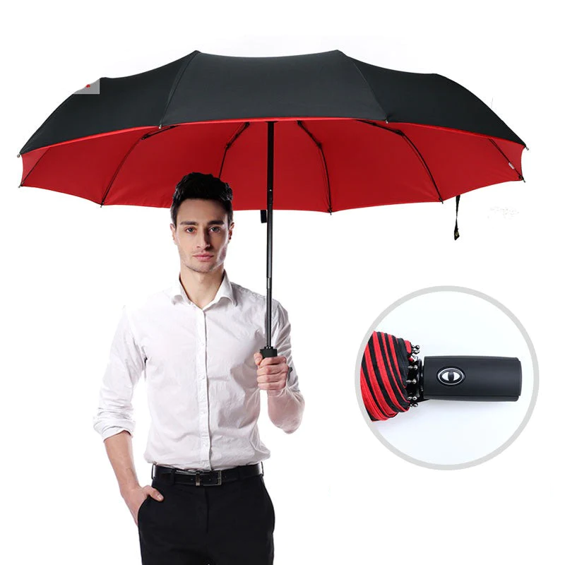 "Winddichter Sturmregenschirm in Rot, robustes Design für Damen, hält starkem Wind stand, handlich und kompakt."