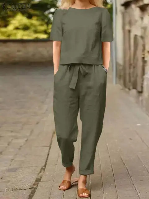 Zweiteiliges Damen Sommer Set mit eleganter Kurzarmbluse und fließenden Haremshosen, ideal für stilvolle Ausflüge.